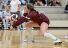 Senior Chloe Munoz (18) with one of her many season digs inches off the floor.
