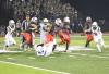 Life School RB Kamarion Pearson (9) is swarmed by the Canton defense. Photo by Michael Seiber.